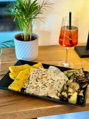 Homemade Vegan chicken in lemon Sauce with grilled vegetables and polenta/potato wedges  at Vegitalian in Salzburg