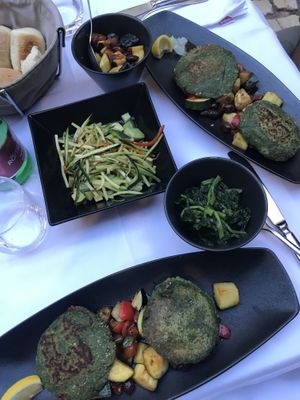 Chickpea burger patties, mangold and zucchini avocado 🥑 salad   at Balbi in Rovinj