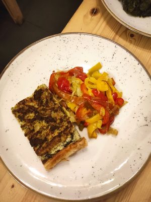Savory pie with almond ricotta and a side of peppers with onions at Idem Con Patate in Turin