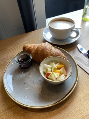 Vegan croissant with jam and fruit; and oat cappuccino.  at Vienhues Deli in Viersen
