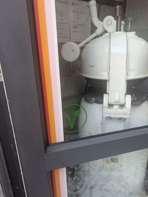 A sneaky vegan sign at Hulis Donuts in Cape Town