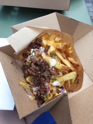 Fries with pickled cucumber, red onion and minced beyond meat at Eden Jaxx - Købmagergade in Copenhagen