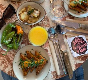 corn fritters 🌽 , pimientos de padròn  at Nowhere in Milan