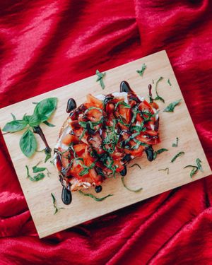 Bazil "Bizu" Bruschetta - Supreme Cream Cheese Tomato Bruschetta with a balsamic glaze and basil leaves 
 at Kappra Cafe in Bangkok