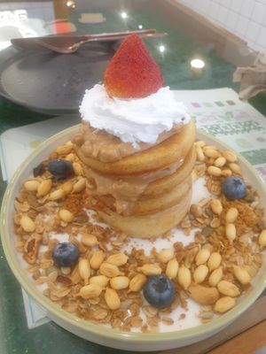 Ig unique item peanut butter pancake with granola topped with strawberry and cream - 6/10 at Kappra Cafe in Bangkok