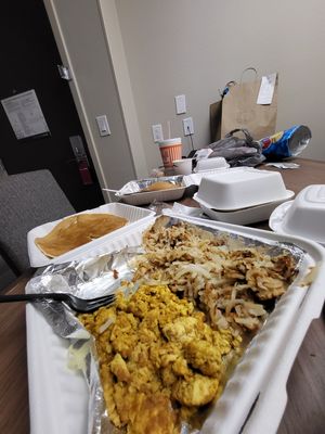 Stack of pancakes hashbrowns and tofu scramble at Seven Mile Cafe in Lewisville