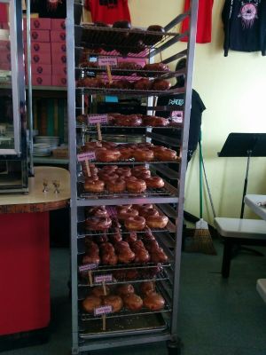 Bringing in the day's glazed. at Pepples Donut Farm in Berkeley