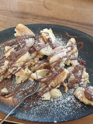 Chocolate Kaiserschmarrn topped with bionella at HeimWerk Schwabing in Munich