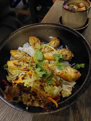 A dish called "What's your Nem" with warm rice noodles salad, spring rolls, asian herbs, Ginger lime, and dressing. at Vegang in Berlin