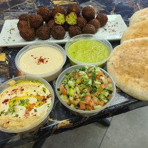 Authentic Pita falafel’s, fresh baked pita bread, homemade is Israeli salad, hummus and much much more    at Taste of Tel Aviv in Houston