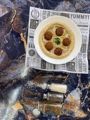 Our delicious homeless falafel plate served with fresh baked pita bread and Israeli salad  at Taste of Tel Aviv in Houston