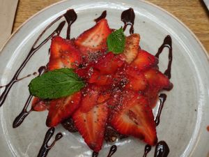 raw chocolate cake with strawberries at Saludpan in Medellin