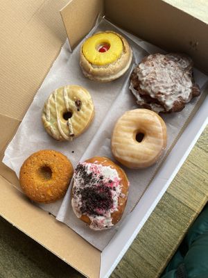 Pumpkin, matcha latte, pineapple upside down, stuffed oreo, vanilla glazed, cinnamon roll fritter  at Deviant Donuts in Mystic