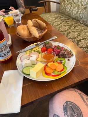 Vegan breakfast platter „ Oma Erikas echte Vollpflanz“, vegan butter, vegan cheese, bean spread, vegan feta, vegan jam, vegetables and 3 buns  at Vollpension in Vienna