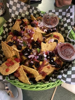 Nachos loaded with salsa, red onions, olives, bell peppers   at Le Gibard in Tadoussac