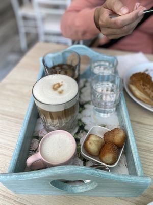 Oat babycino, espresso tonic, vanilla latte (oat milk), vegan mini-donuts.  at La Donuteria in Munich
