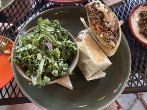 Beef burrito with kale salad  at Vegan Street in Calgary