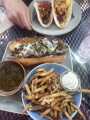 Mushroom taco & no-fish taco on top; beaf dip with garlic fries on bottom. All delicious! at Vegan Street in Calgary