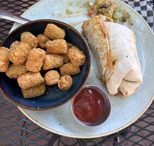 Breakfast Burrito and Parmesan Tater Tots  at Vegan Street in Calgary