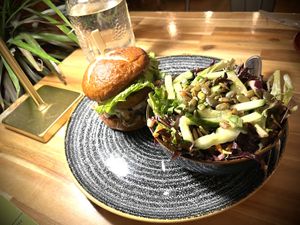 Truffle mushroom burger with greens  at Vegan Street in Calgary