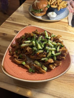 Ginger beef (appetiser but with the jasmine rice add on) chicken burger in backround  at Vegan Street in Calgary