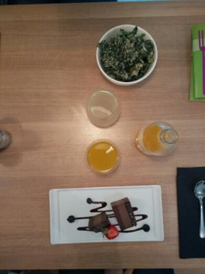 Triple chocolate cake, passionfruit lemonaid, lemon lime drink, and sour cream onion kale chips! at simpleRaw - Oehlenschlaegersgade in Copenhagen