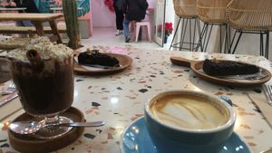 We had the only vegan desert, the chocolate brownie, and a cappuccino and hot chocolate (the whipped cream is not vegan). It was super good! at MOYA brunch in Sevilla