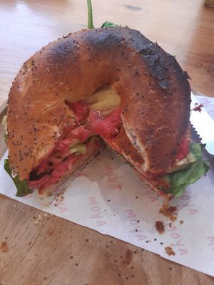 bagel with avocado and hummus at MOYA brunch in Sevilla