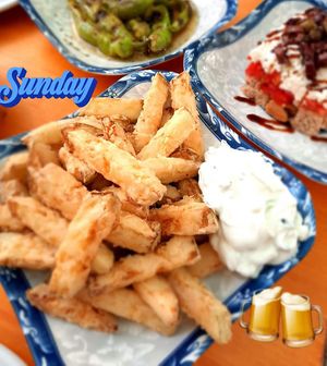 fried zuchini sticks with our homemade tztziki 
 at  Mandalaki Coffee Tavern - Μανταλάκι Καφέ Μεζεδοπωλείο in Kozani