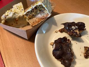 Snickers on the right, pistachio nut shortbread on the left (already broken open to reveal inside) at The Sweet Vegan in Nuremberg