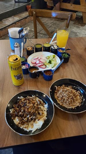 Tripa Fundido (left) and Asada taco (right) at La Ambivalencia Taquería in Guadalajara