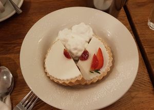 Iced cherry bakewell with whipped vegan cream at The Bakewell Tart Shop in Bakewell