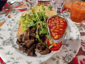 Vegan breakfast with hummus, avocado, two slices of toast, mushrooms and tomatoes. Ask the waiter to add the baked beans to your order. at Bill's in Richmond