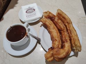 Vegan dark hot chocolate with porras at Chocolateria 1902 in Madrid