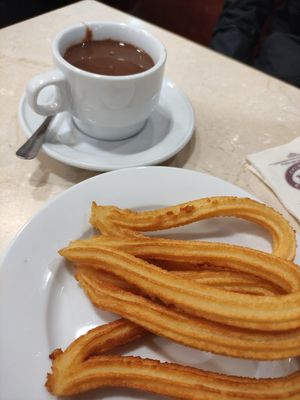 Churros + chocolate (vegan, 7.50 EUR) at Chocolateria 1902 in Madrid
