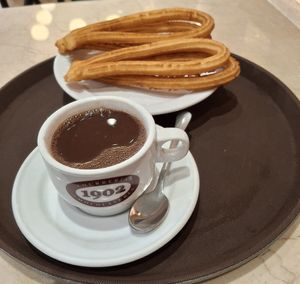 Chocolate and churros at Chocolateria 1902 in Madrid