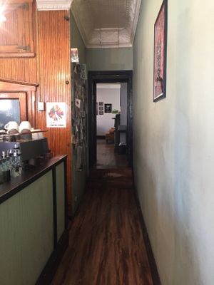 Hallway to back seating area  at Grindcore House in Philadelphia