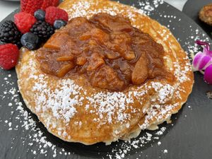 Peach cobbler pancakes are the best brunch item on the menu hands down!  at Gaia & Loki in Jersey City