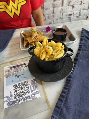 Mac & Cheese
Shell pasta, creamy cheese sauce, topped with butter, herbed bread crumbs, and shredded parmesan cheese  at Gaia & Loki in Jersey City