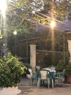 outdoor seating - view of the marina - next to main road at Akrogliali in Corfu