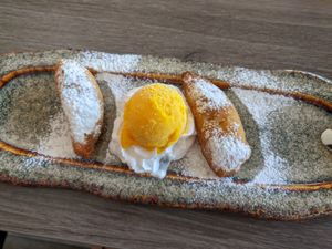 Baked banana with plant based whipped cream and mango sorbet at De Orchidee in Eindhoven