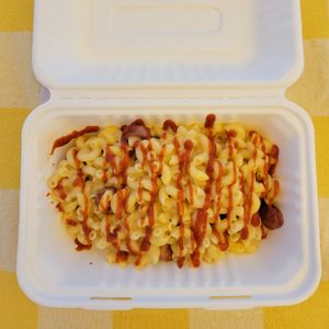 Mac n cheese with a cut up hotdog and sriracha at The Lick in Vallejo