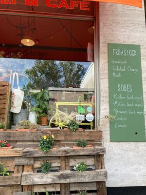 Outside and vegan sweets menu at Café Orange in Bonn