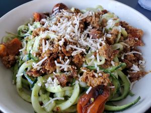 Zucchini pesto noodles with sausage at Veggie Grill by Next Level in Santa Monica