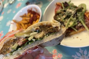 Digging in to the Falafel.  I added lettuce, Vegan Parm and hot pepper flakes to the pizza cus I had them.  The pizza is delicious ‘as is” but since I was home...  at Fresca on Addison in Richmond