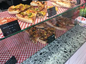 Pizza slices for mix and match at Pizzi*s & Cream in Vienna