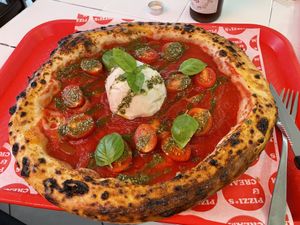 Pizza with a vegan burrata  at Pizzi*s & Cream in Vienna