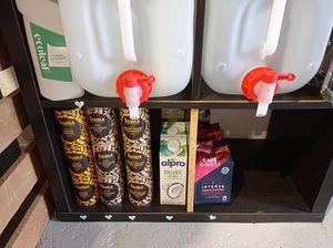 Suma cupboard essentials including baked beans, coconut milk and coffee. at Green Heart Collective in Gateshead