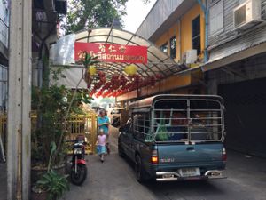 look down the alley for these lanterns  at Chijuya Restaurant - Jing Xin Health Food in Bangkok