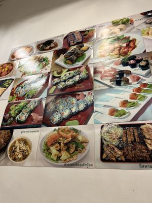 walls are filled with images of the dishes. Owner is very kind and will recommend food   at Chijuya Restaurant - Jing Xin Health Food in Bangkok